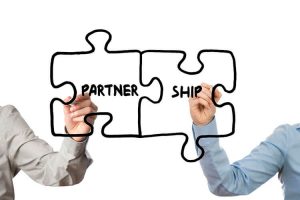 partnership1 300x200 - About Us